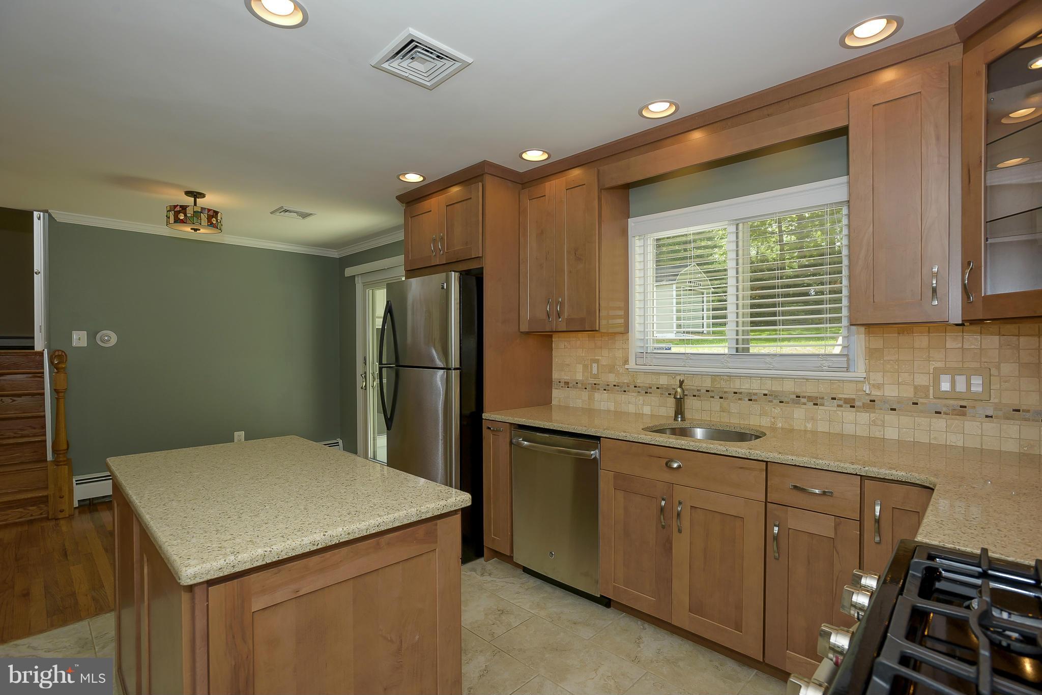 100 Shortcross Road Linthicum Heights, MD 21090 - Photo 9 of 30 a kitchen with a sink appliances and cabinets