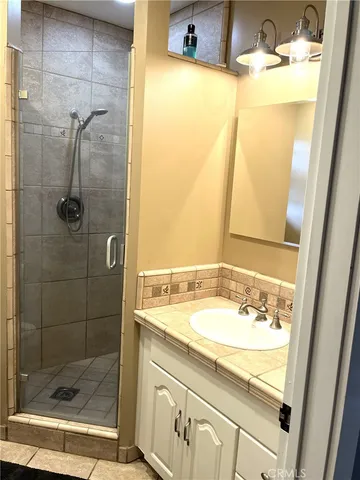 an empty room with wooden floor and closet