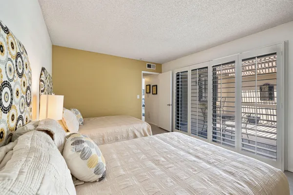 a bedroom with a bed and a cabinets