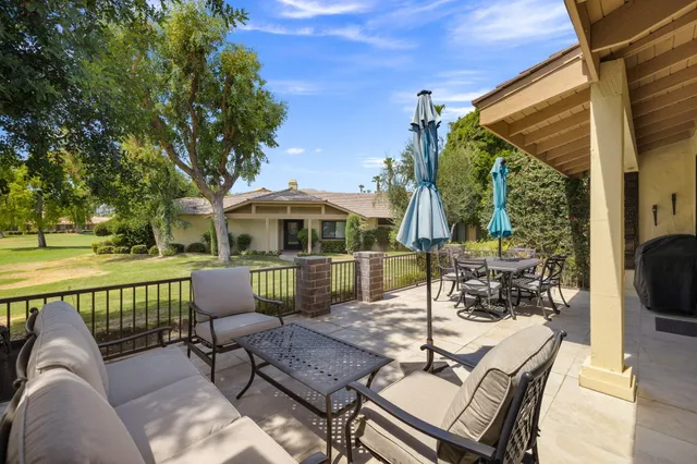 a view of a patio with a table chairs and a patio