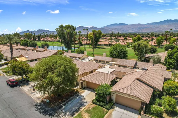 a view of a terrace with a garden and mountain view