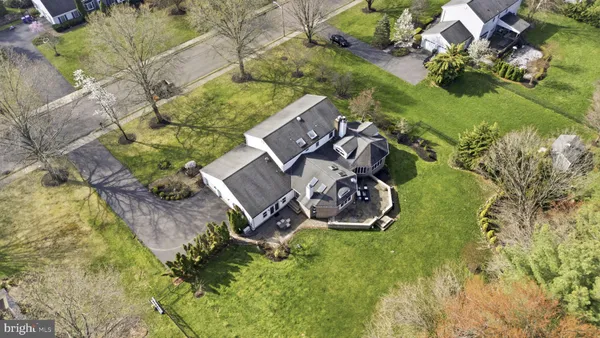 an aerial view of a garden with swimming pool