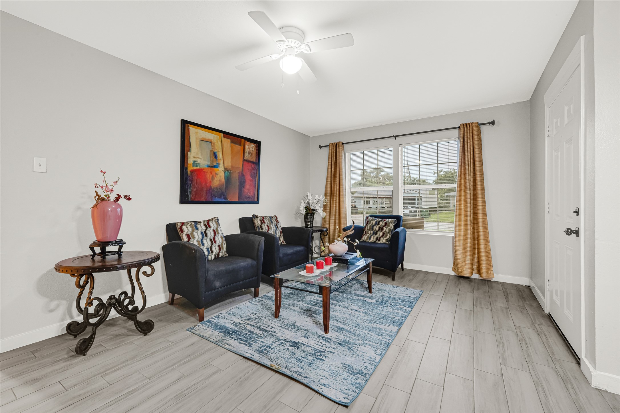 5009 Bataan Road Houston, TX 77033 - Photo 9 of 24 a living room with furniture and wooden floor