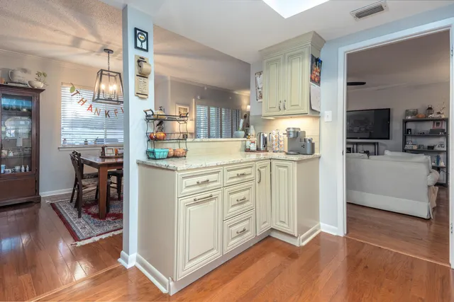 a kitchen with stainless steel appliances granite countertop a sink stove and microwave