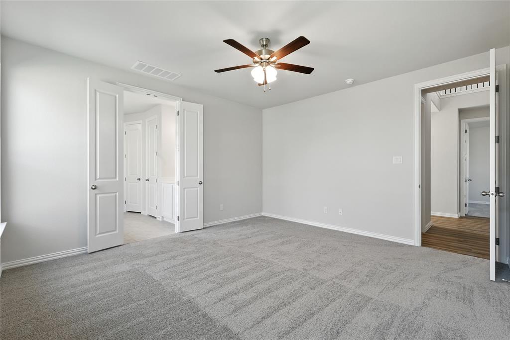 2515 Ridgecrest Lane Sherman, TX 75092 - Photo 15 of 40 Unfurnished bedroom with carpet flooring and a ceiling fan