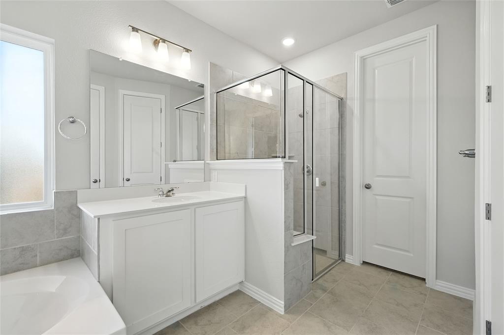 2515 Ridgecrest Lane Sherman, TX 75092 - Photo 19 of 40 Bathroom with a shower stall, vanity, and a bathtub