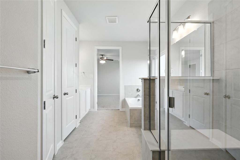 2515 Ridgecrest Lane Sherman, TX 75092 - Photo 20 of 40 Full bath featuring a bath, ceiling fan, and a shower with shower door