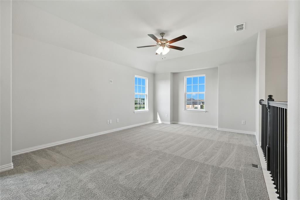 2515 Ridgecrest Lane Sherman, TX 75092 - Photo 26 of 40 Carpeted empty room with baseboards and ceiling fan