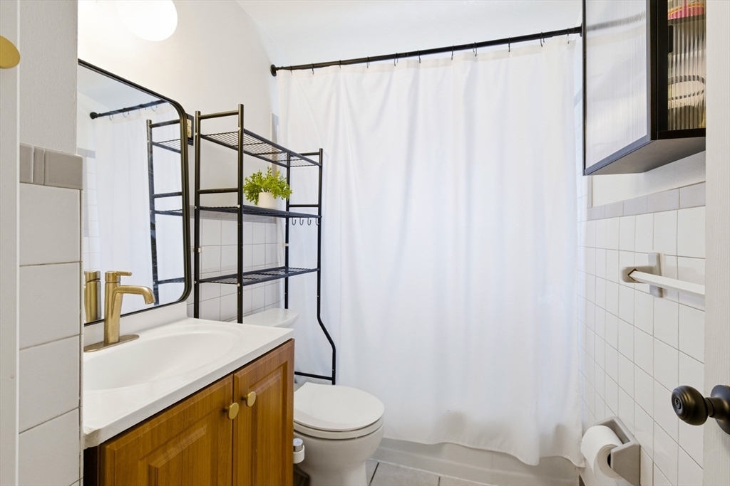 5 Lewis Farm Road, Unit 5 Dedham, MA 02026 - Photo 15 of 18 a bathroom with a sink toilet and shower