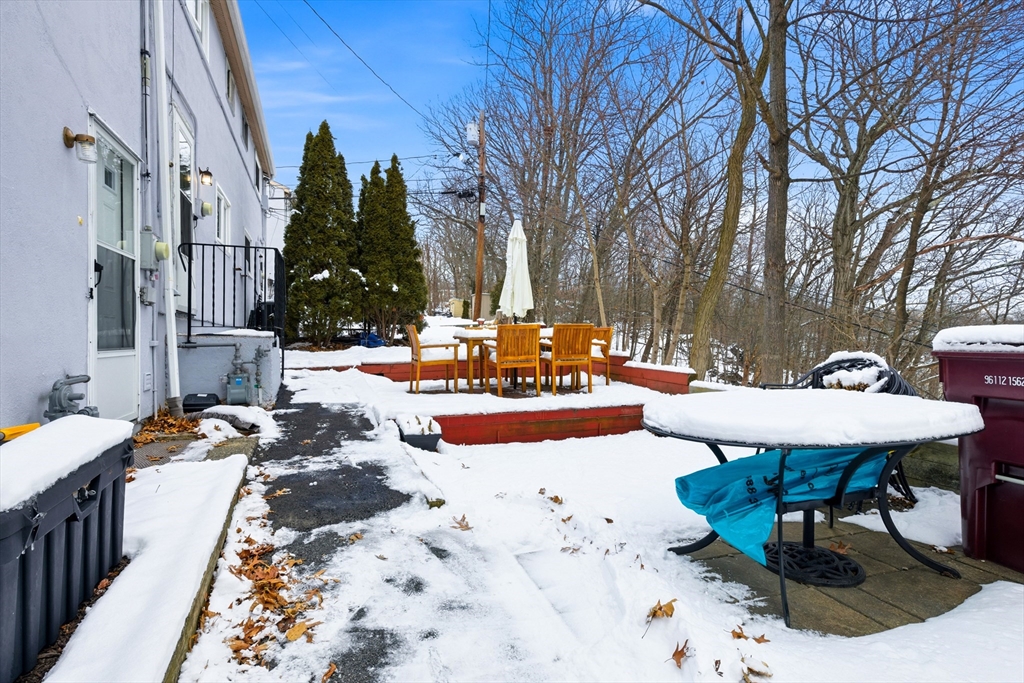 5 Lewis Farm Road, Unit 5 Dedham, MA 02026 - Photo 17 of 18 a view of a patio with swimming pool