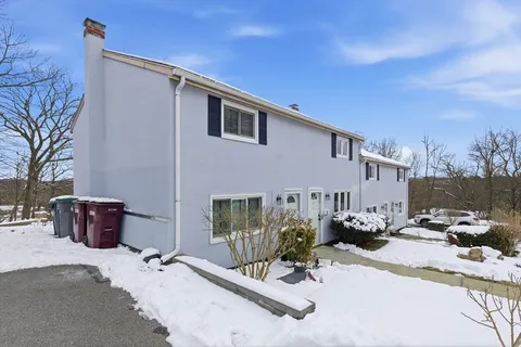 a view of a patio with a table and chairs