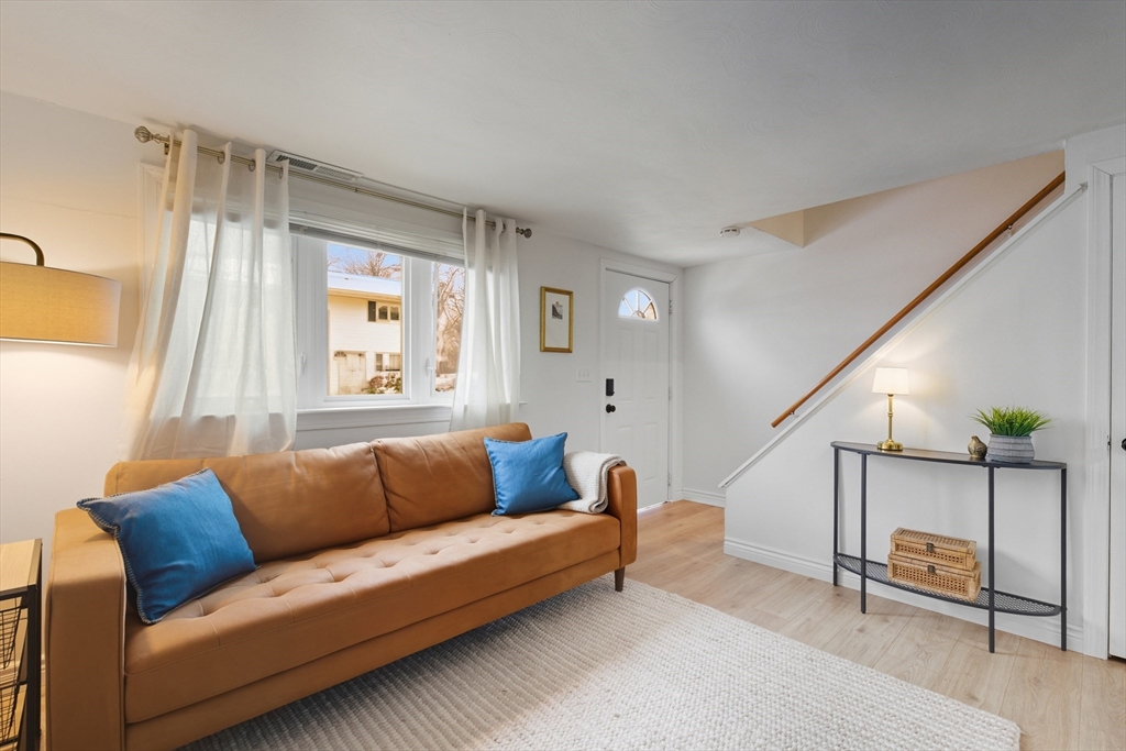 5 Lewis Farm Road, Unit 5 Dedham, MA 02026 - Photo 4 of 18 a living room with furniture and a window