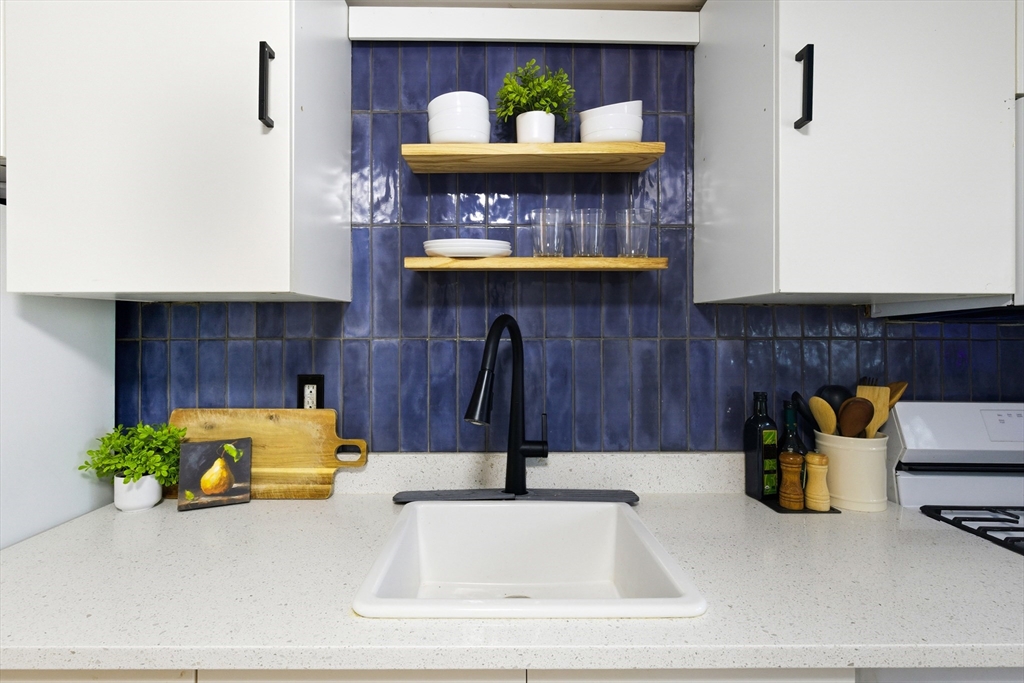 5 Lewis Farm Road, Unit 5 Dedham, MA 02026 - Photo 9 of 18 a bathroom with a sink and a mirror