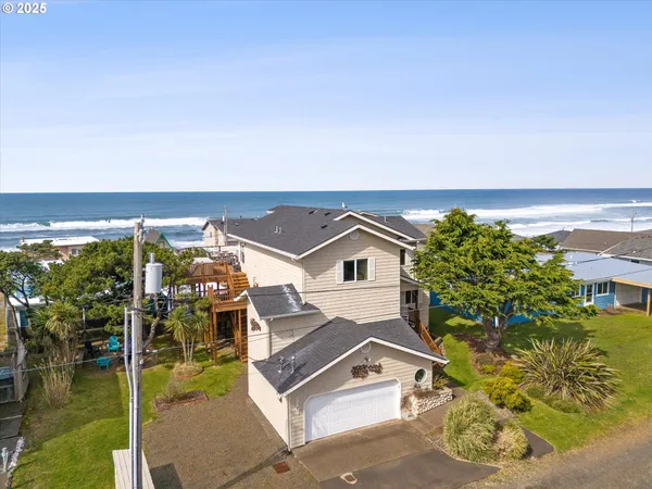 an aerial view of a house with a ocean view