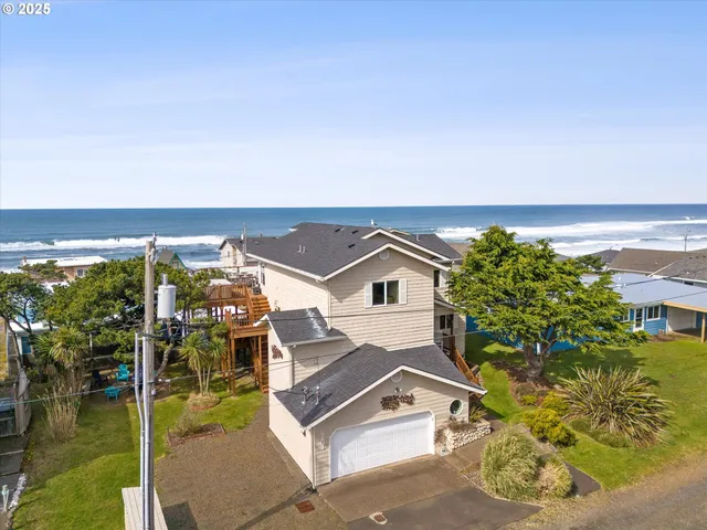 an aerial view of a house with a ocean view