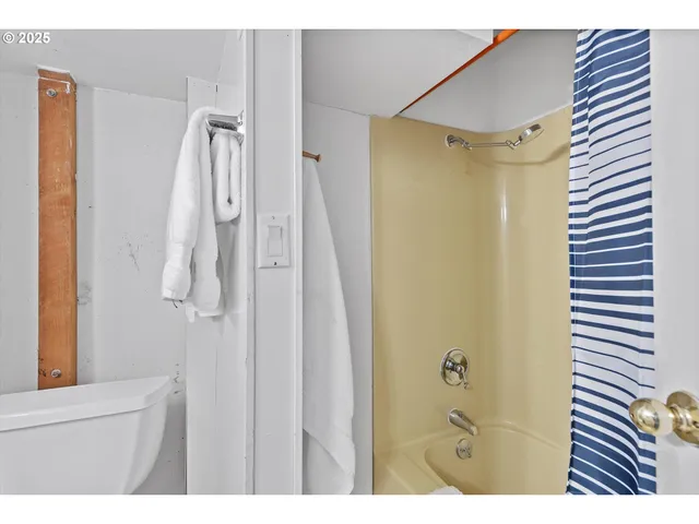 a bathroom with a shower and a sink