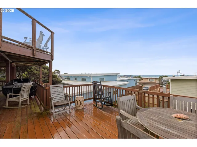 a view of a balcony with wooden floor
