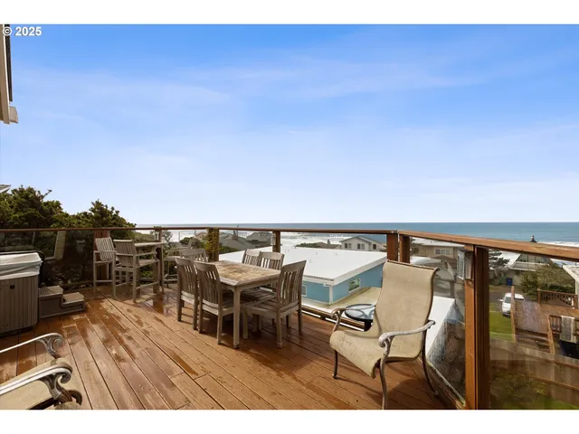 a terrace of a house with wooden floor outdoor seating
