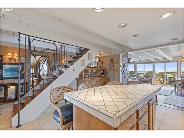 a view of house and hall with wooden floor