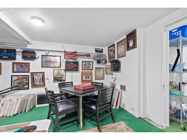 a utility room with lots of furniture and toys