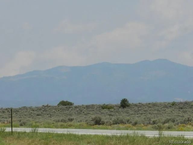 a view of ocean and mountains