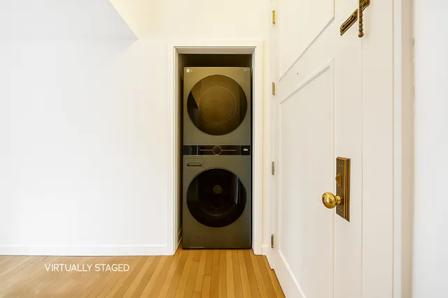 a view of a hallway with washer and dryer