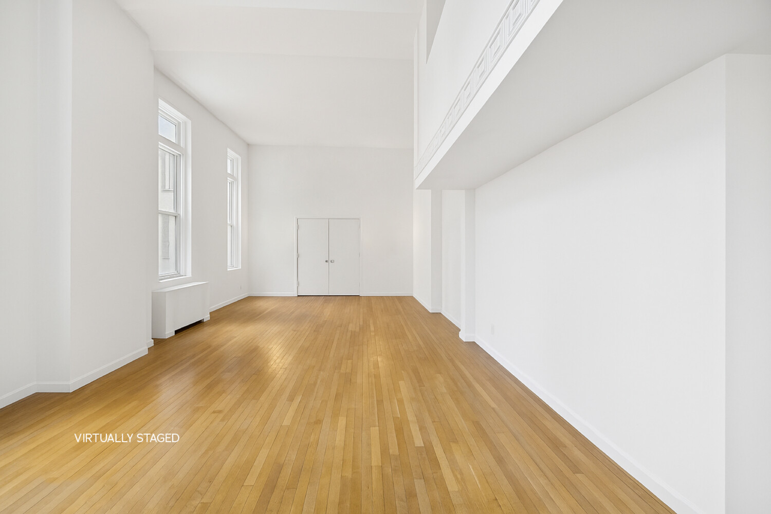 240 Centre Street, Unit 3B Manhattan, NY 10013 - Photo 4 of 20 a view of empty room with wooden floor