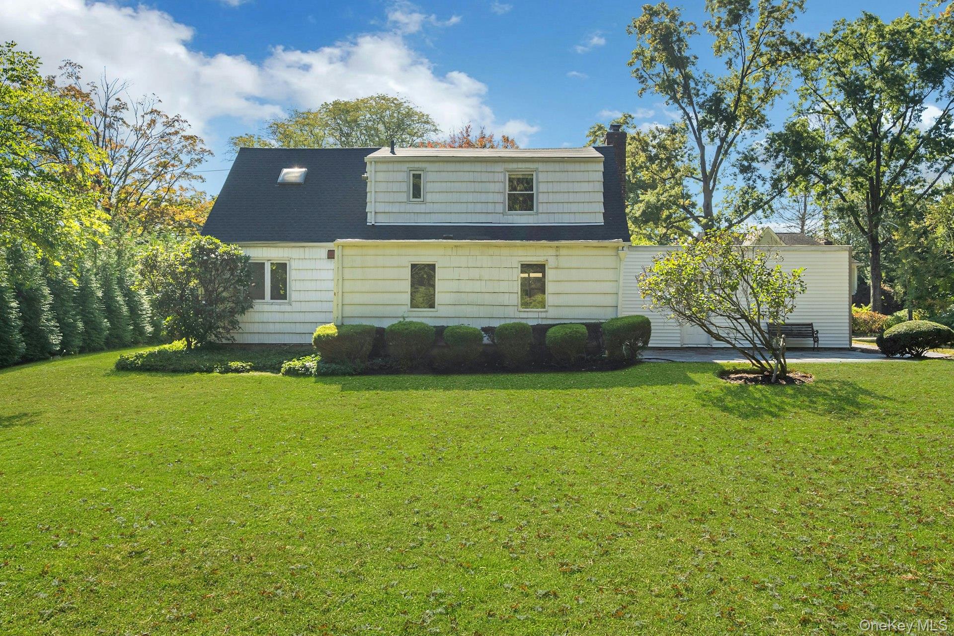 13 Colonial Road Scarsdale, NY 10583 - Photo 25 of 33 Well-manicured backyard and rear view of home