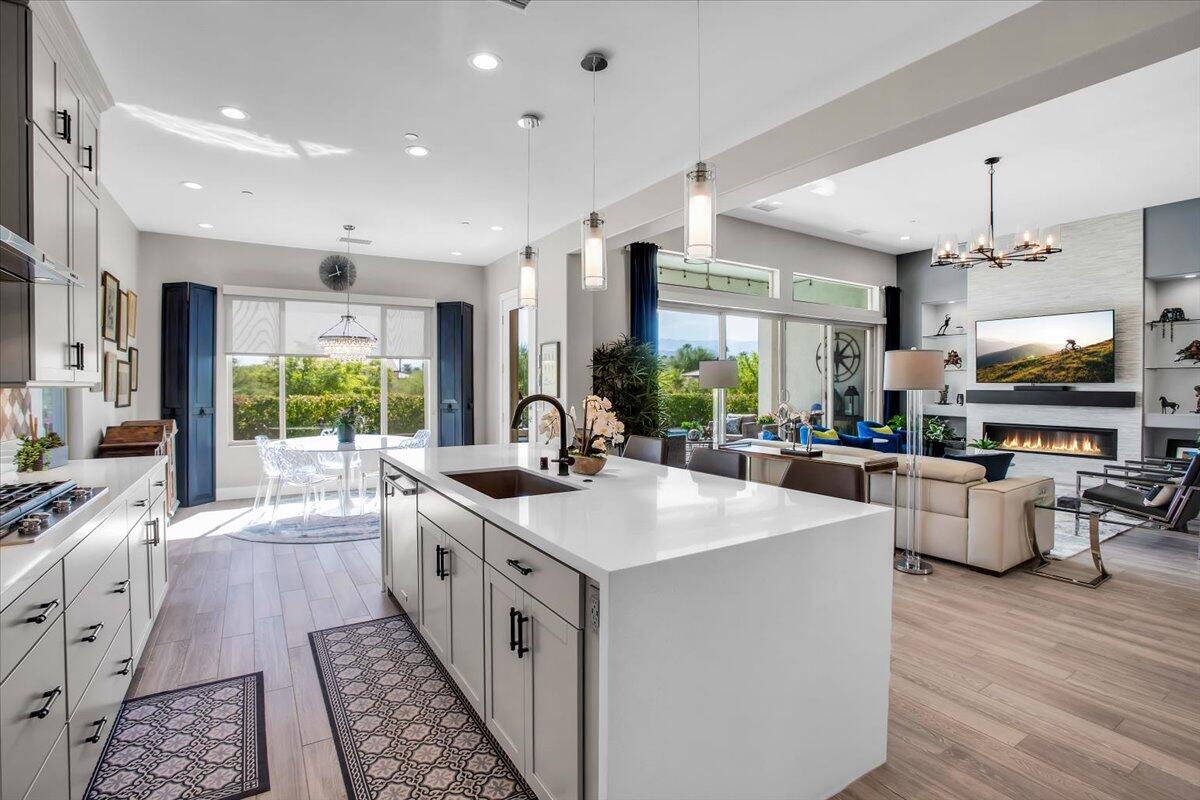 74 Barolo Rancho Mirage, CA 92270 - Photo 14 of 56 a large kitchen with stainless steel appliances a lot of counter space and a wooden floor
