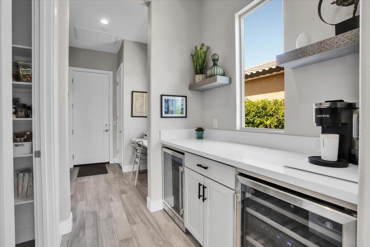 74 Barolo Rancho Mirage, CA 92270 - Photo 17 of 56 a kitchen with a refrigerator and window