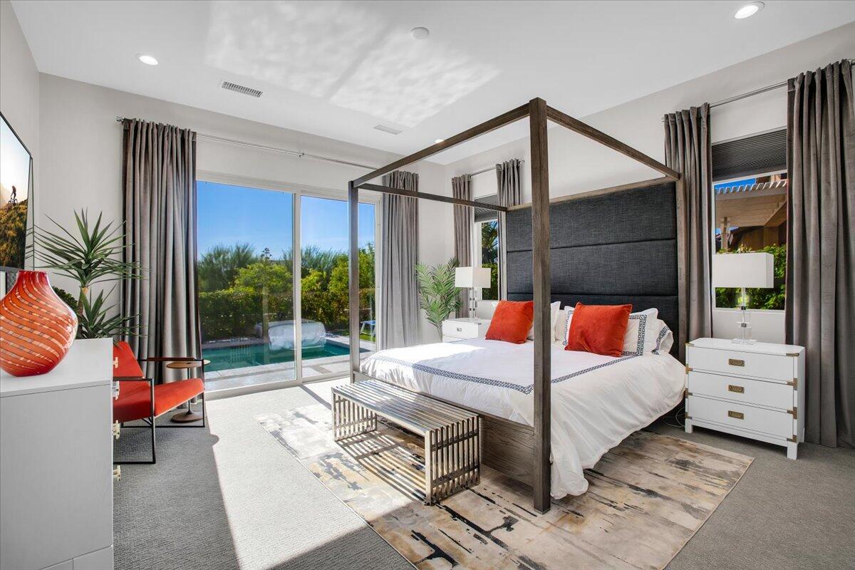 74 Barolo Rancho Mirage, CA 92270 - Photo 20 of 56 a bedroom with a bed and a large window