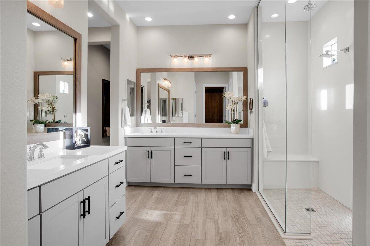 74 Barolo Rancho Mirage, CA 92270 - Photo 22 of 56 a spacious bathroom with a granite countertop sink mirror and shower