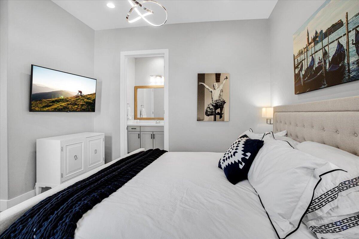 74 Barolo Rancho Mirage, CA 92270 - Photo 28 of 56 a bedroom with a bed and a flat screen tv