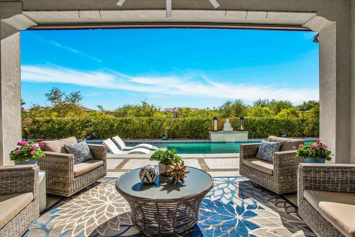 74 Barolo Rancho Mirage, CA 92270 - Photo 30 of 56 a outdoor living space with furniture and garden view