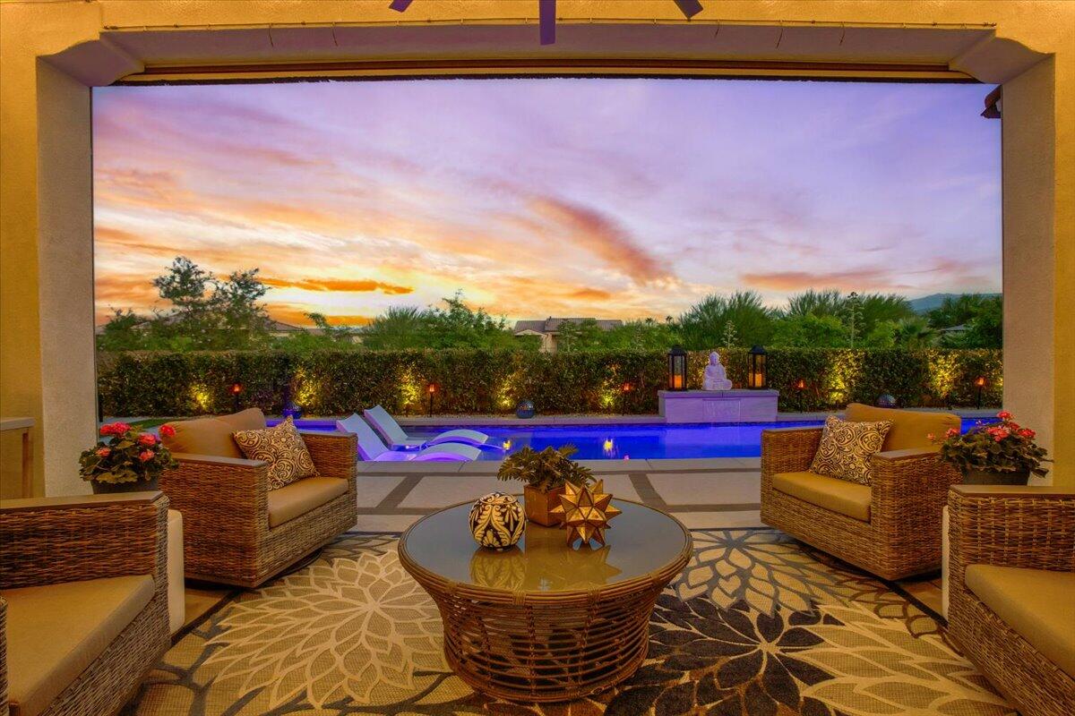 74 Barolo Rancho Mirage, CA 92270 - Photo 39 of 56 a view of a patio with couches chairs and a potted plant
