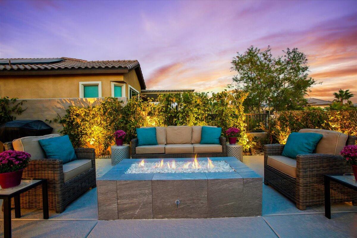 74 Barolo Rancho Mirage, CA 92270 - Photo 41 of 56 a view of a patio with couches and a potted plant on a table
