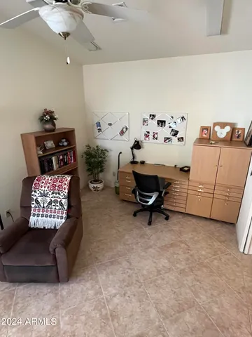 a bedroom with bed and window