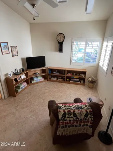 a dining room with furniture a rug and a large window
