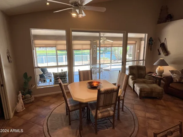 a dining room with furniture and chandelier