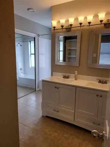 a white toilet sitting next to a bath tub