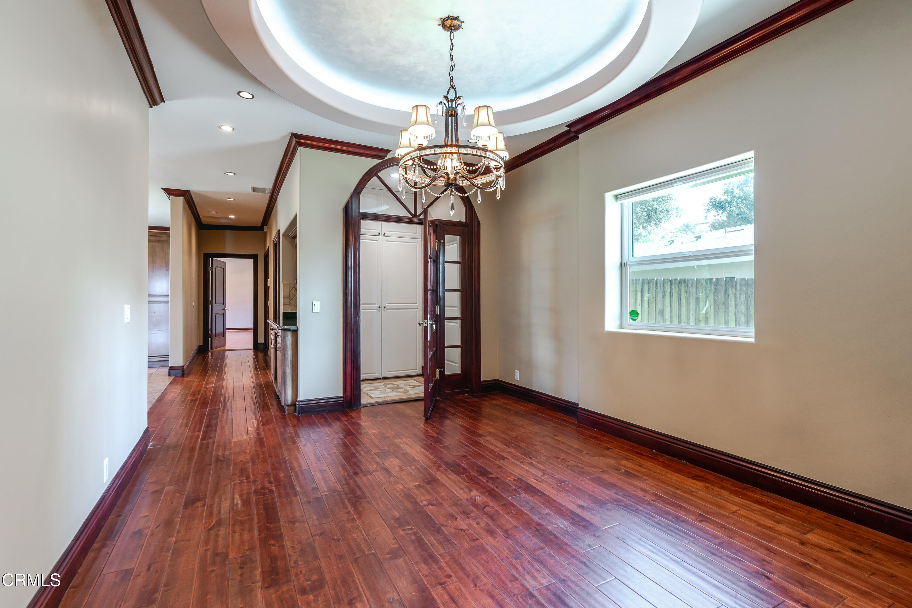 825 Chehalem Road La Canada Flintridge, CA 91011 - Photo 11 of 34 a view of a room with wooden floor chandelier and windows