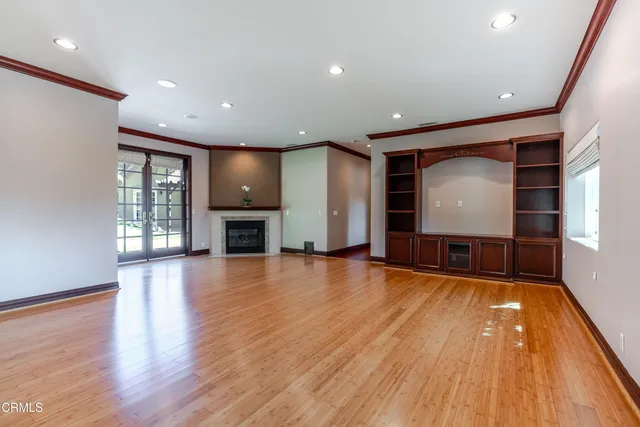 a view of a kitchen with a sink and a fireplace
