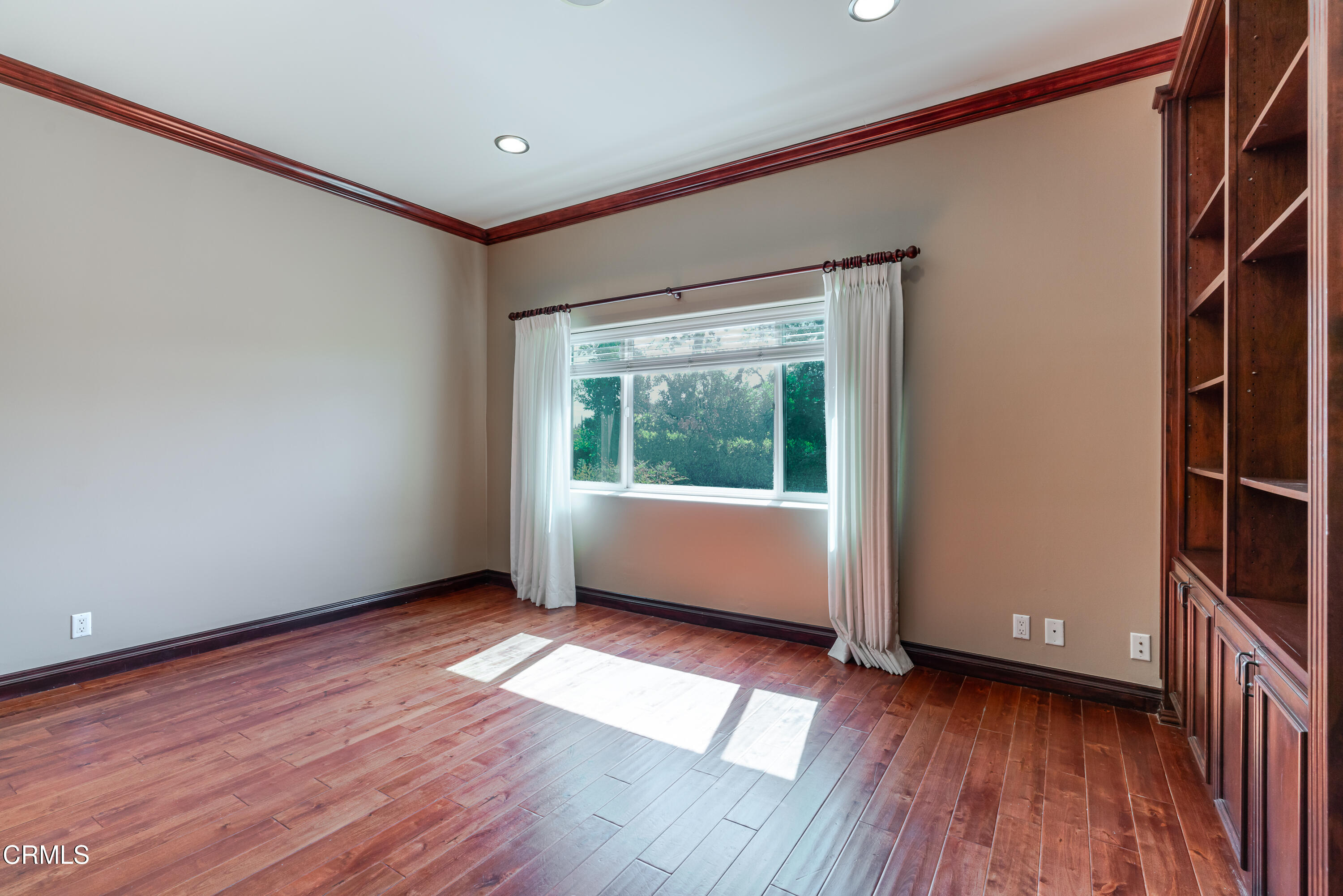 825 Chehalem Road La Canada Flintridge, CA 91011 - Photo 20 of 34 a view of a room with wooden floor and doors