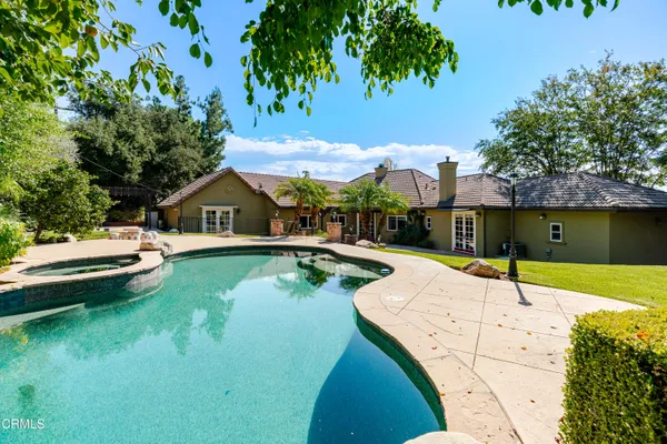 a view of a swimming pool with a patio