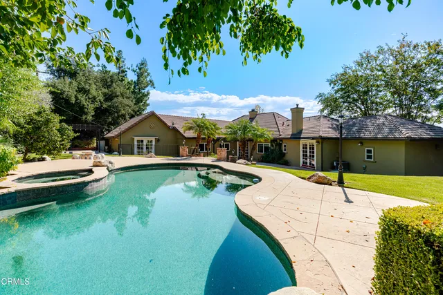 a view of a swimming pool with a patio