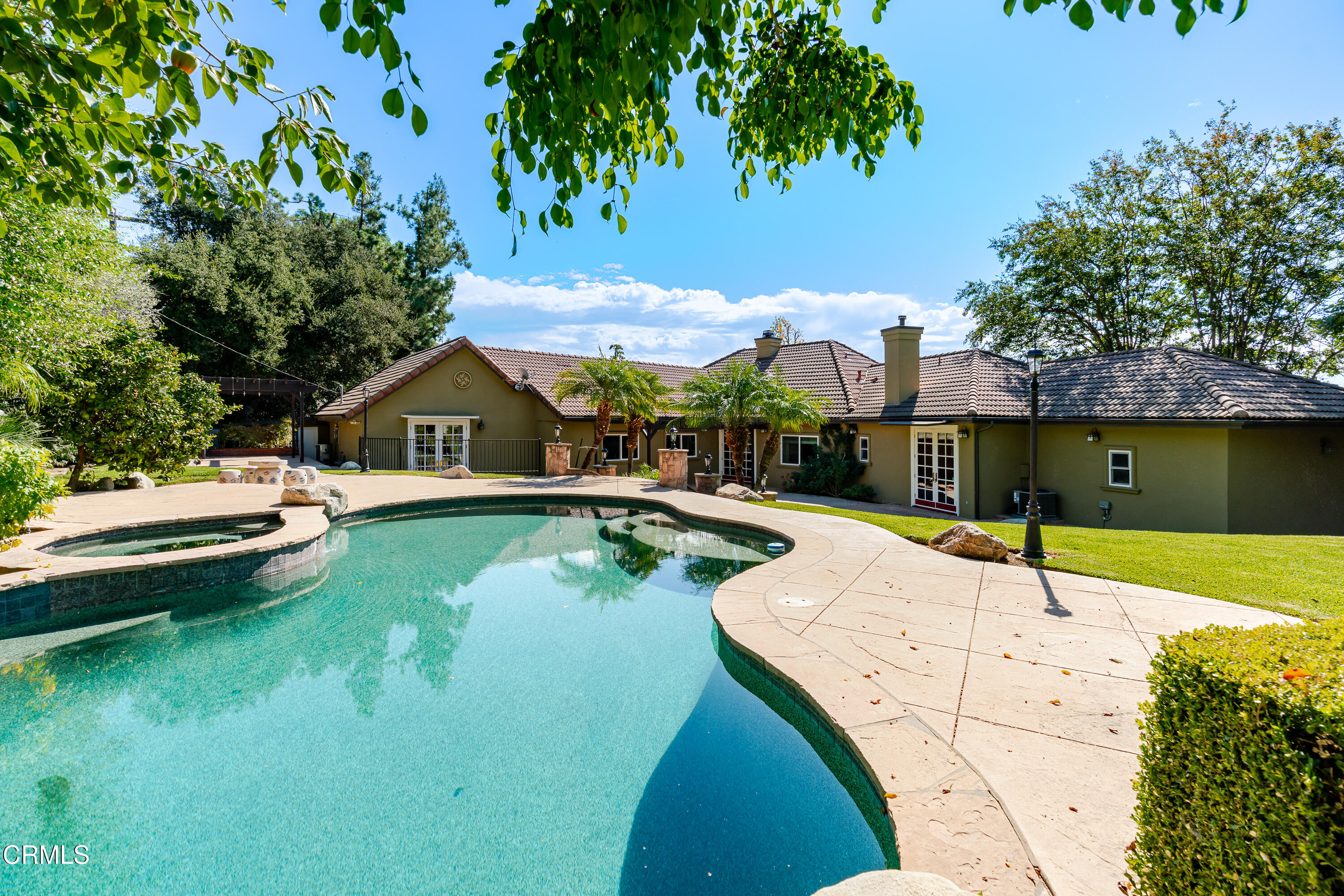 825 Chehalem Road La Canada Flintridge, CA 91011 - Photo 32 of 34 a swimming pool with some trees in the background