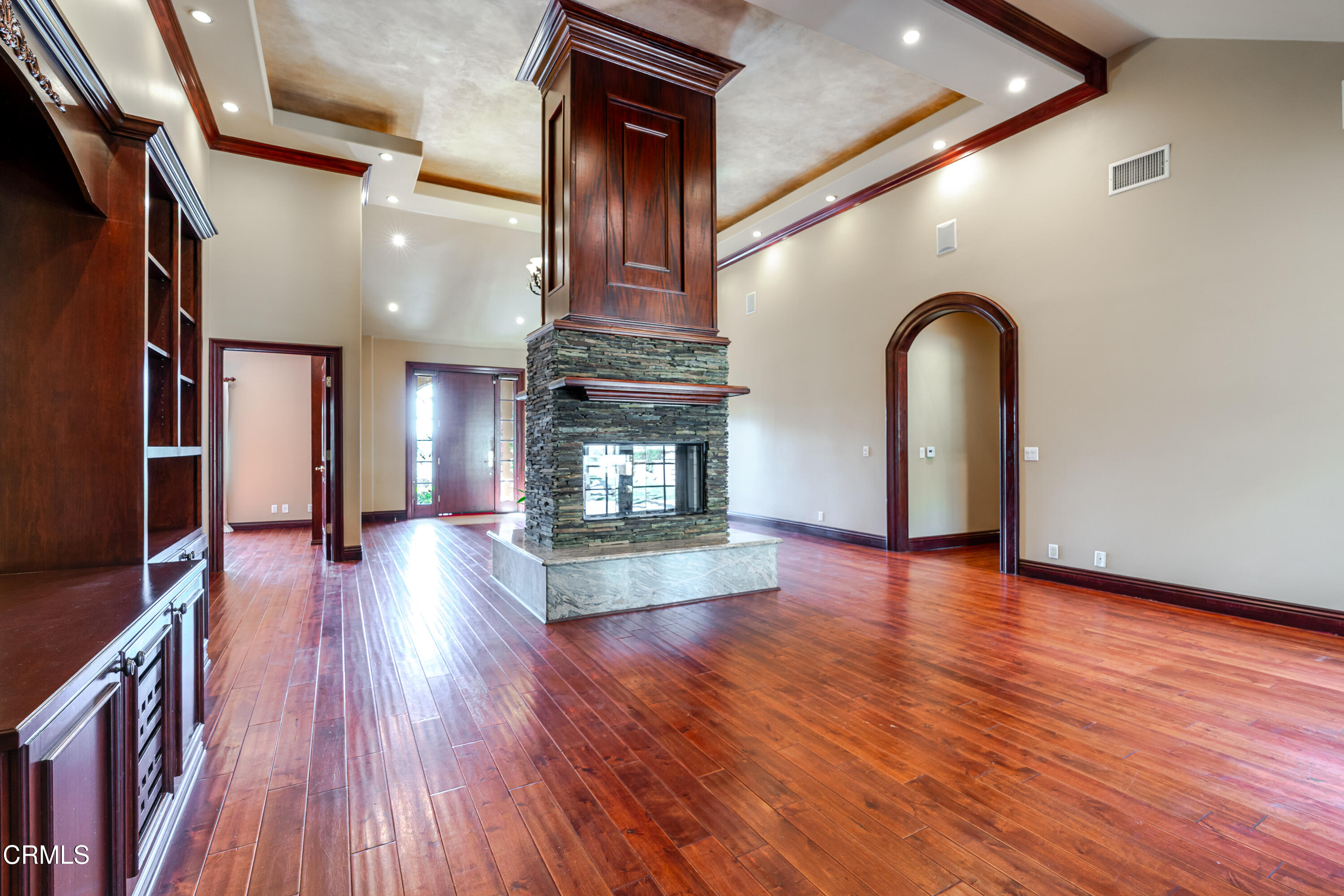 825 Chehalem Road La Canada Flintridge, CA 91011 - Photo 5 of 34 a view of empty room with wooden floor and fireplace
