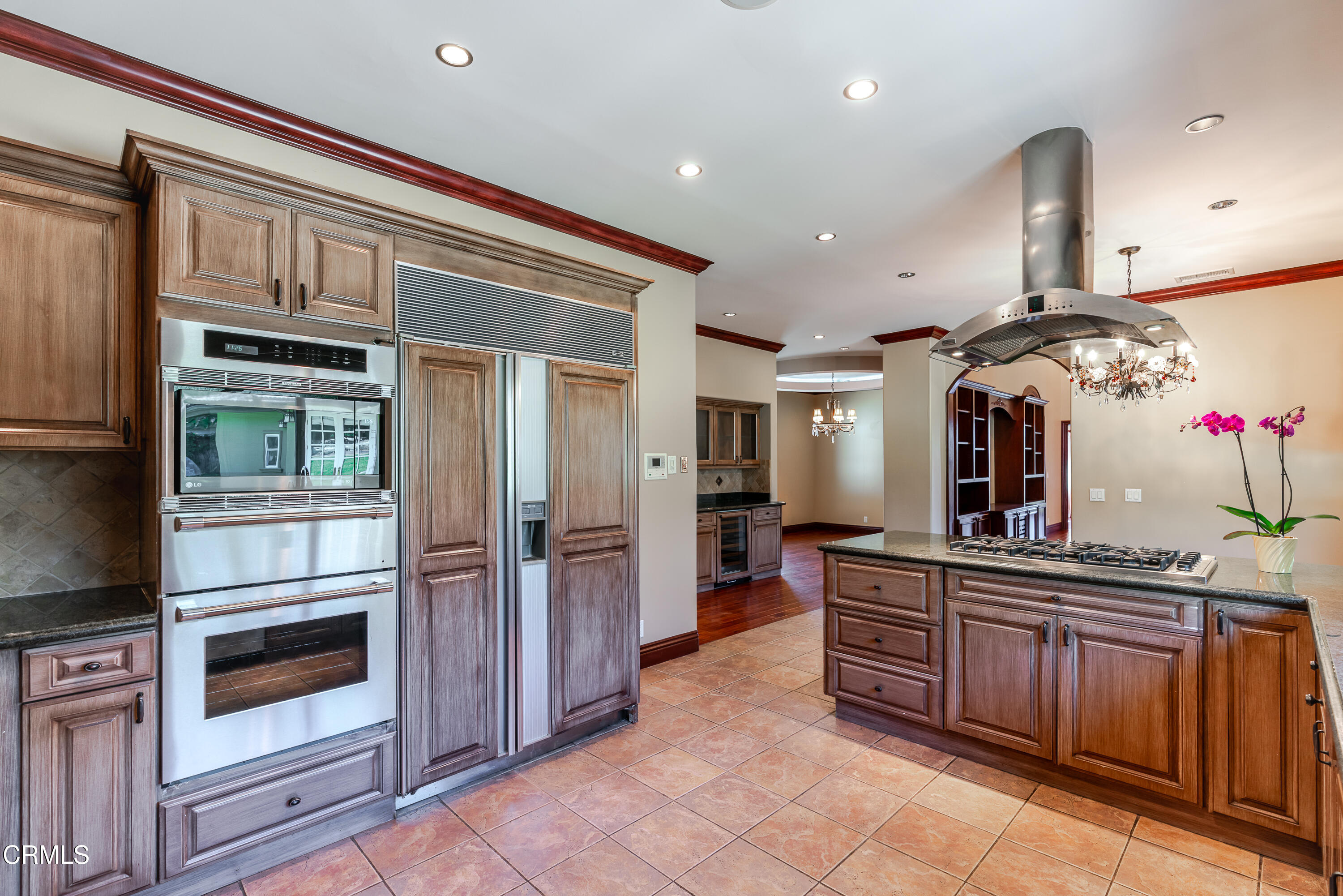 825 Chehalem Road La Canada Flintridge, CA 91011 - Photo 9 of 34 a kitchen with stainless steel appliances a sink and cabinets