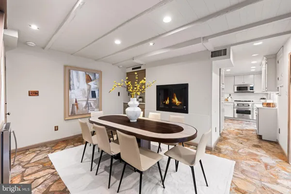 a dining room with furniture and window