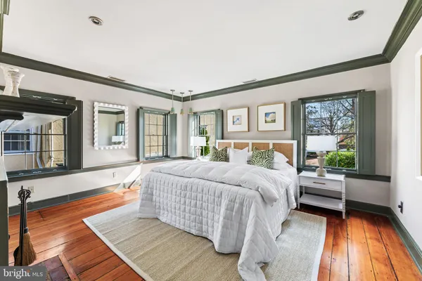 a bedroom with a bed and a fireplace